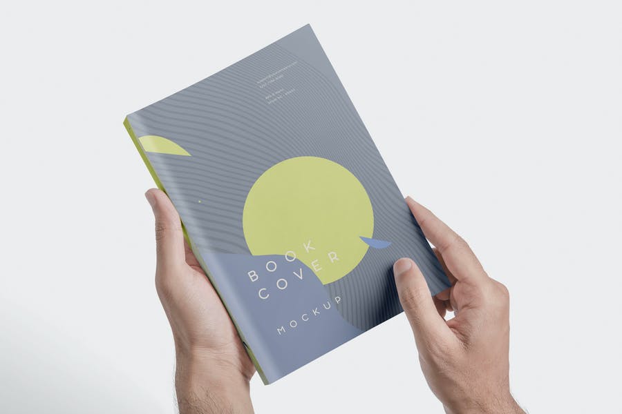 Book Cover in Hand Mockup PSD